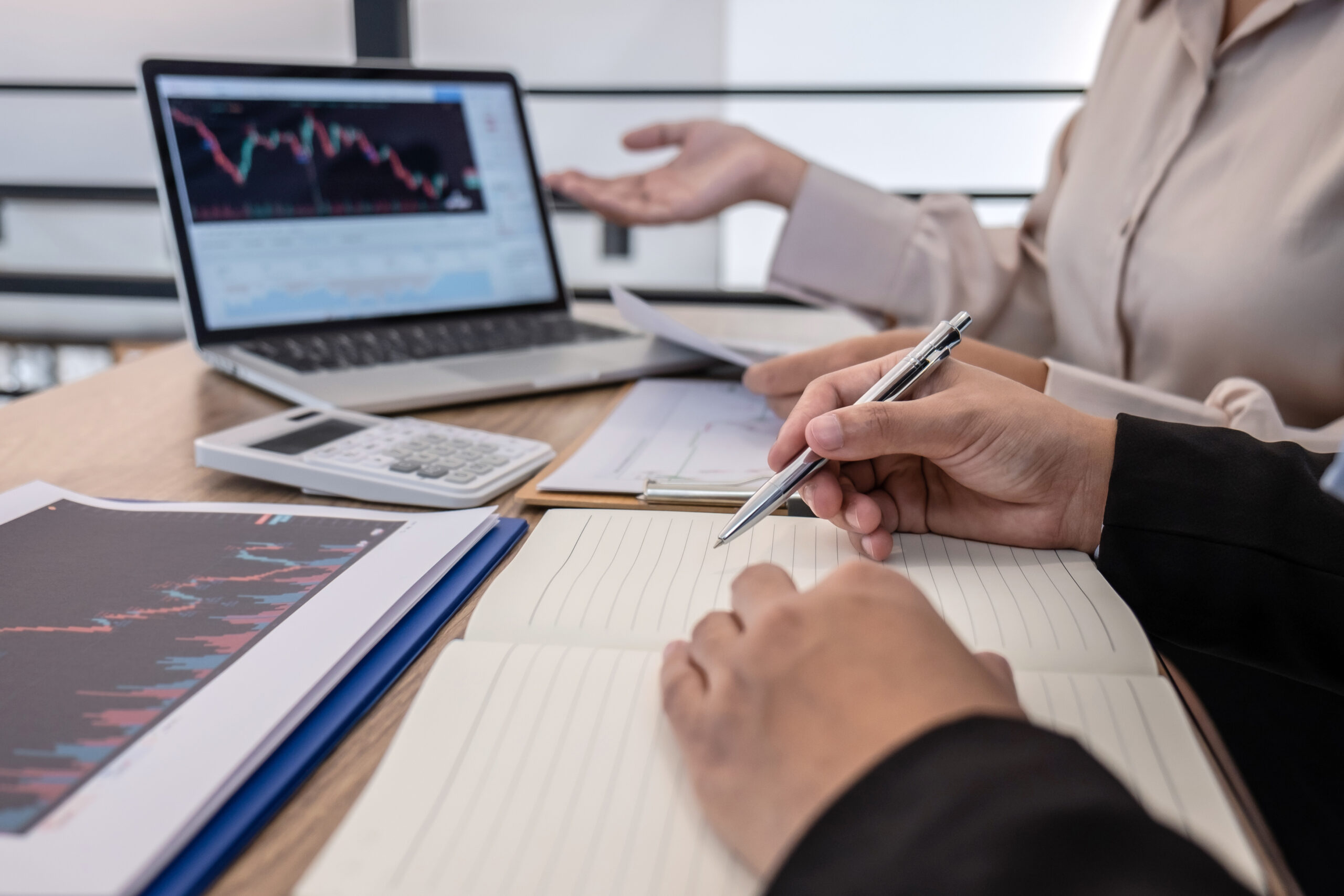 Businesswoman investor on meeting having planning and analyzing