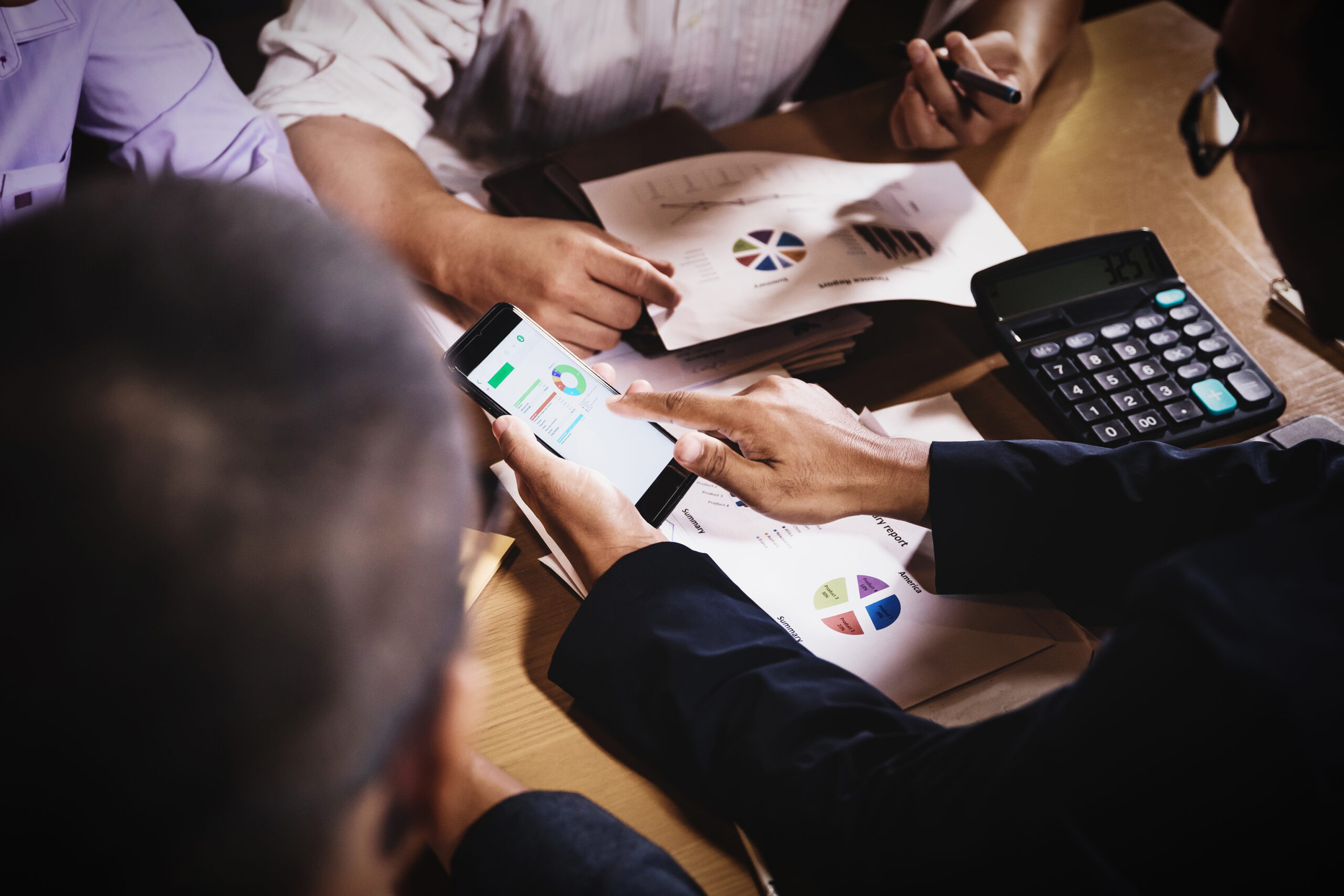 businessmen discussing work sitting in office conference room at