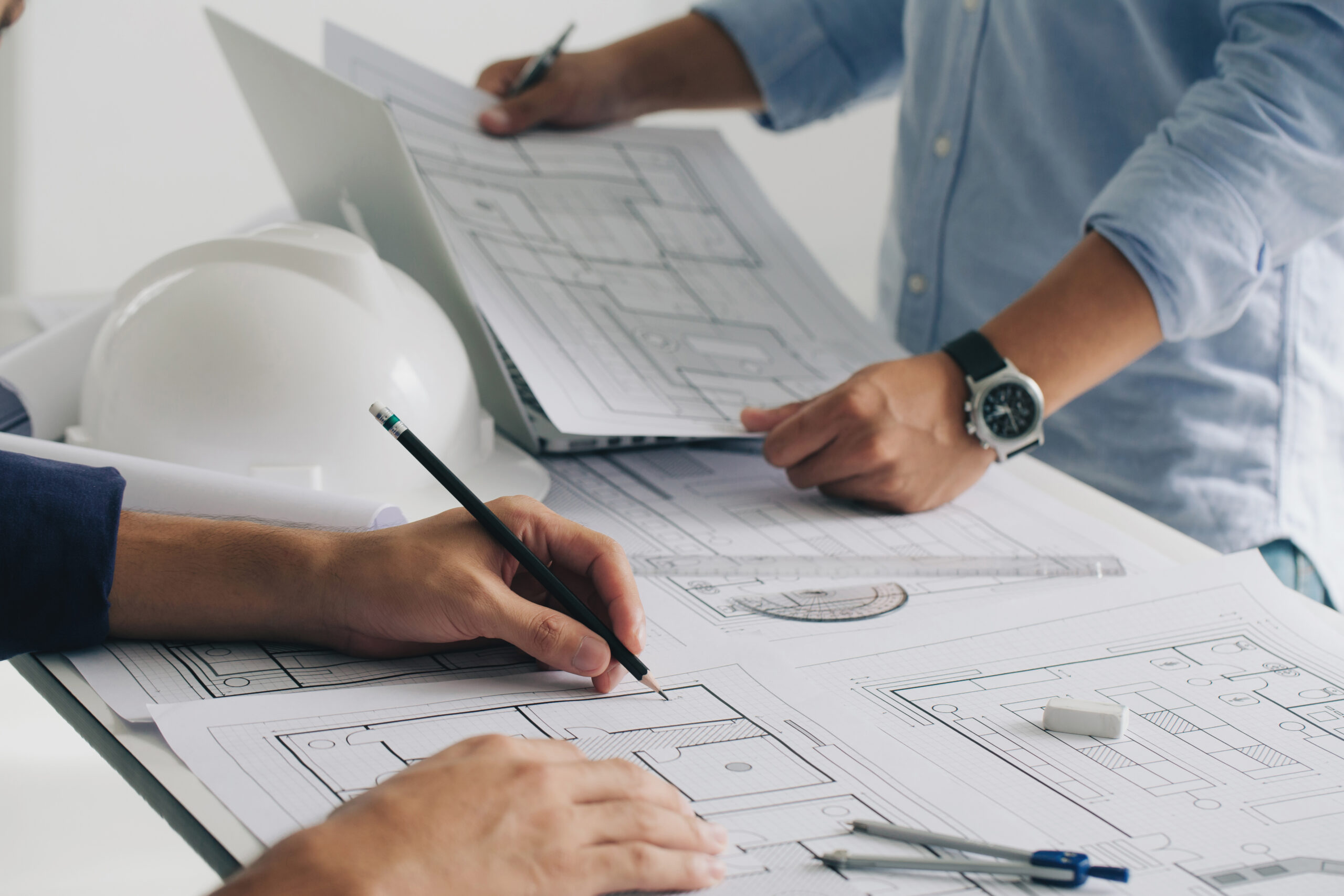 Engineer constuction and interior team dissussing in the office.