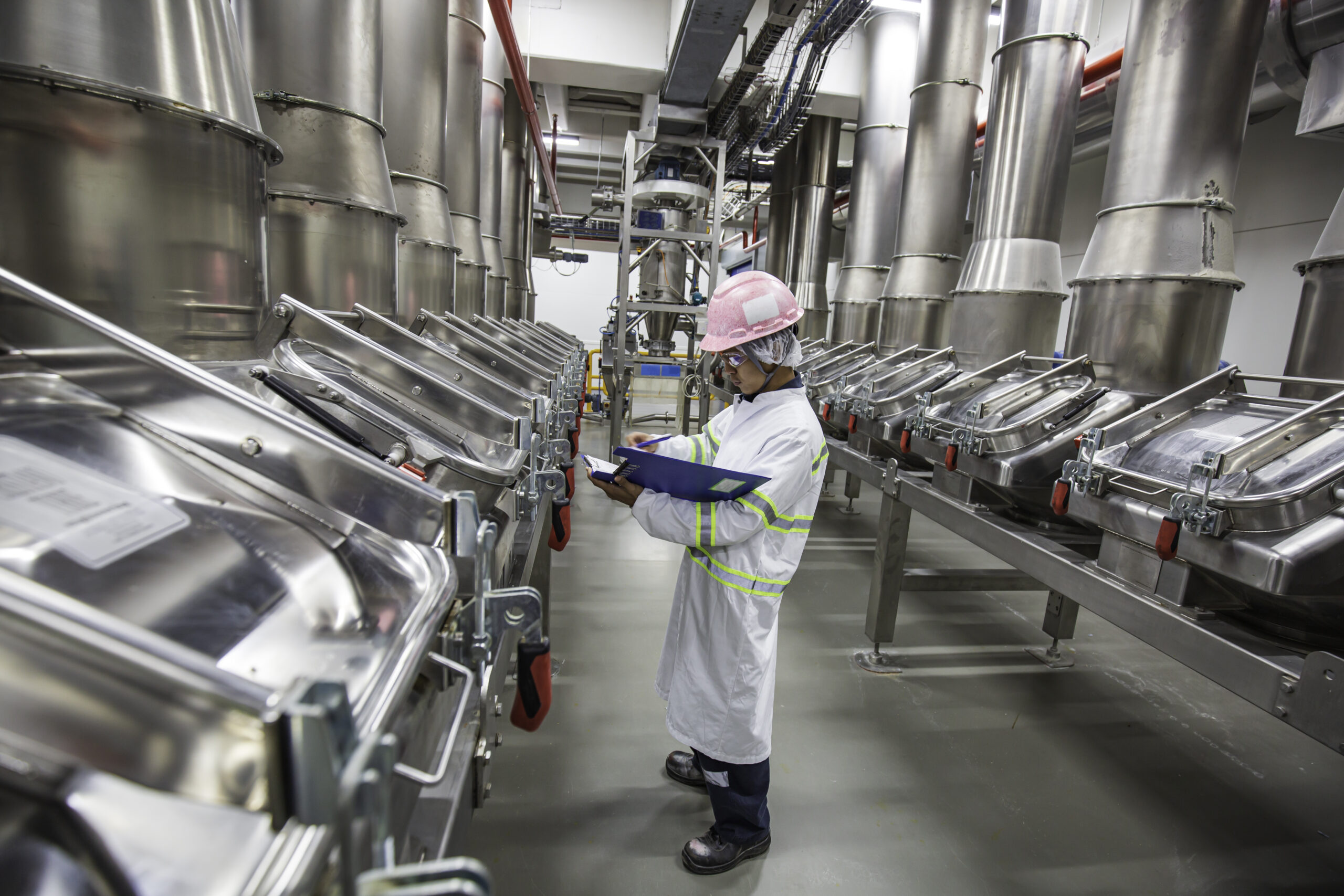 Male worker inspection the process of food drink at the manufact